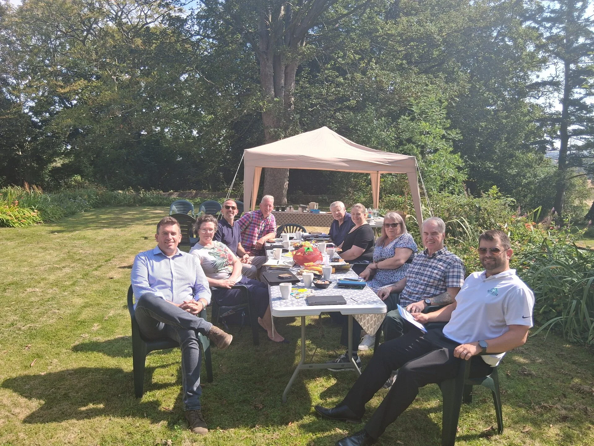 Ten group summer outdoor meeting in garden